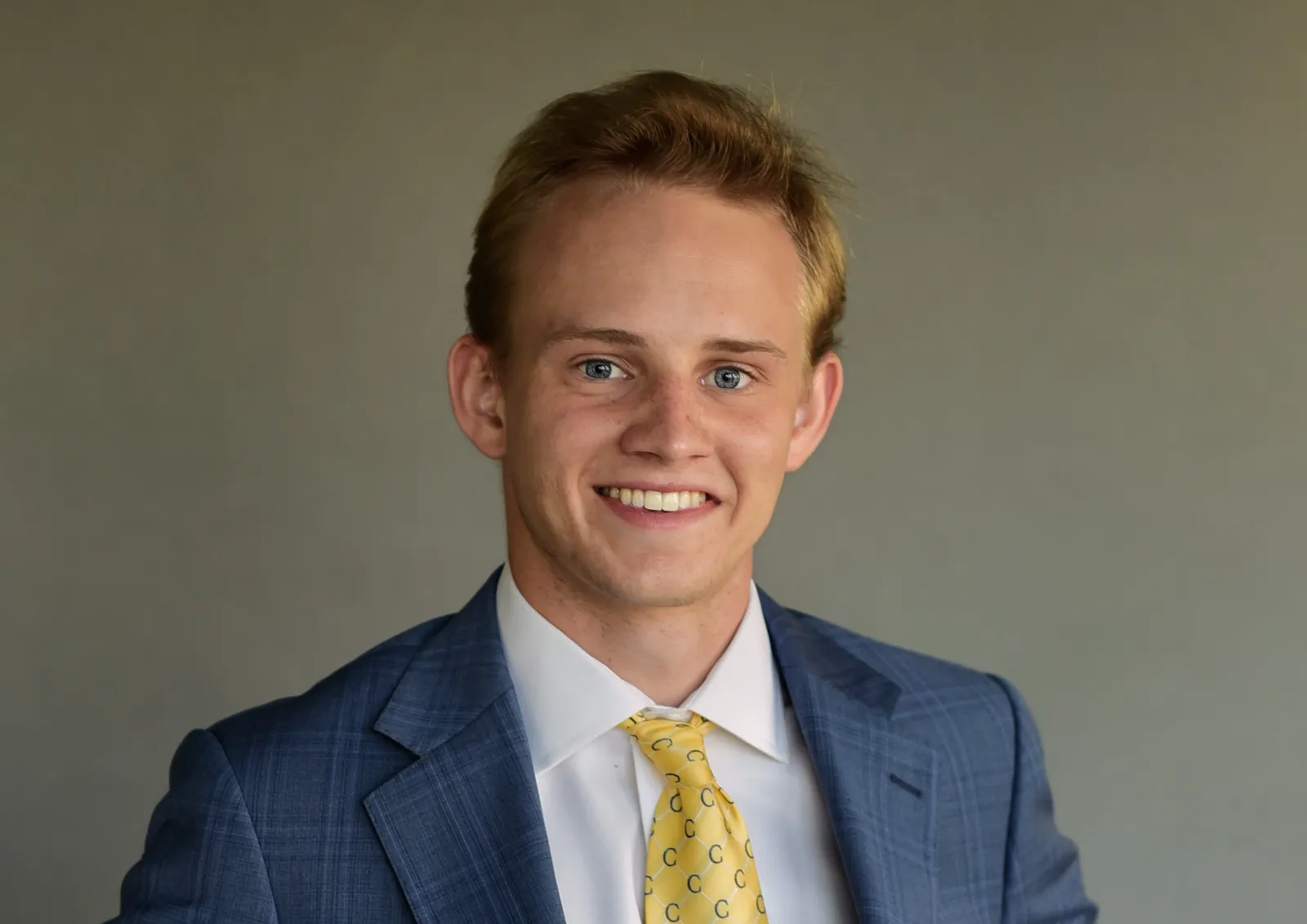 Dean Cochran in a blue suit and yellow tie